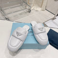 PRADA SOFT PADDED NAPPA SHEARLING MULES WHITE LAMBSKIN