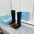 PRADA 25S POINTED TALL BOOTS 50MM IN BLACK CALFSKIN WITH LOGO
