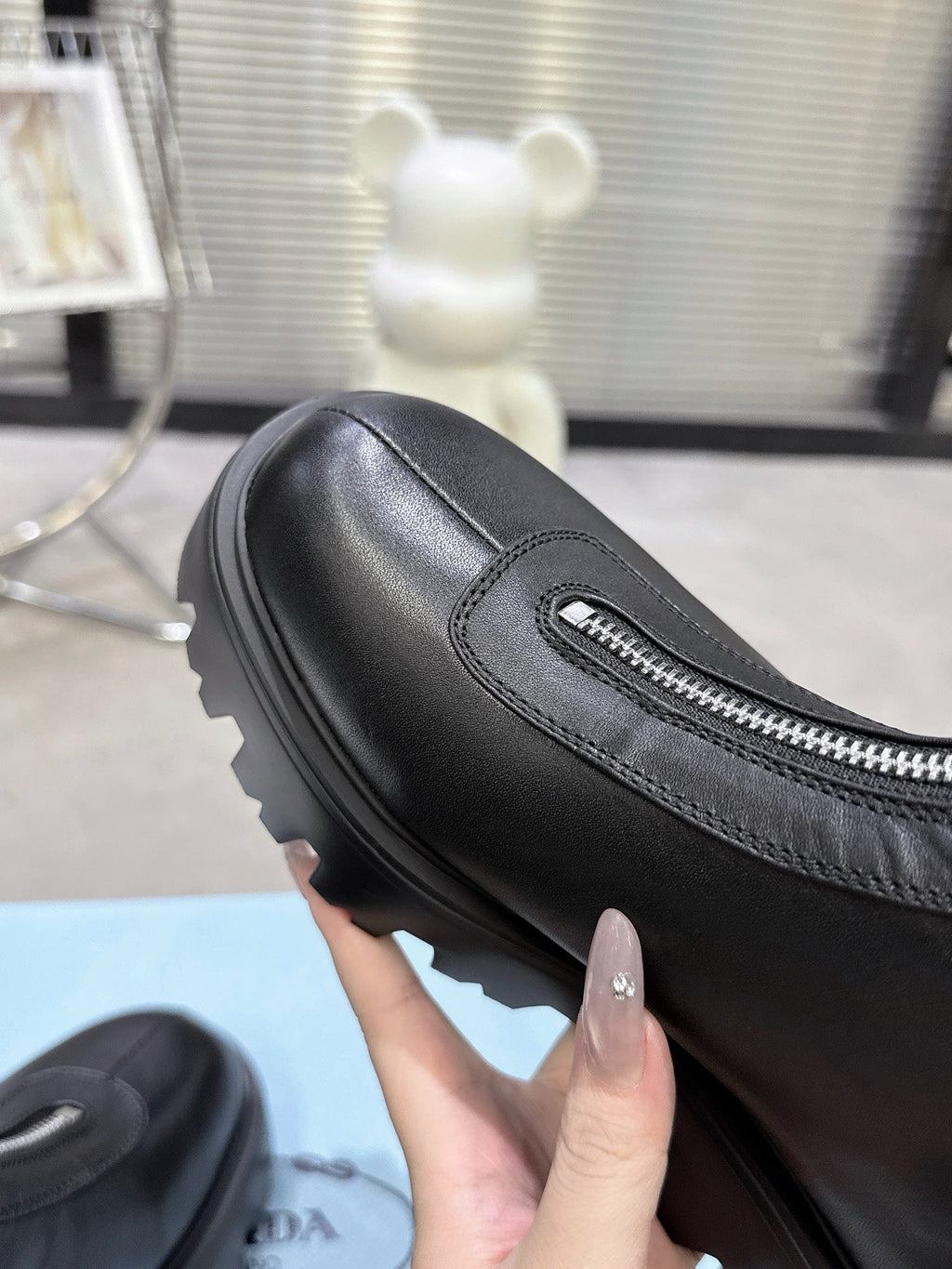PRADA 25S ZIP-UP ANKLE BOOTS IN BLACK CALFSKIN