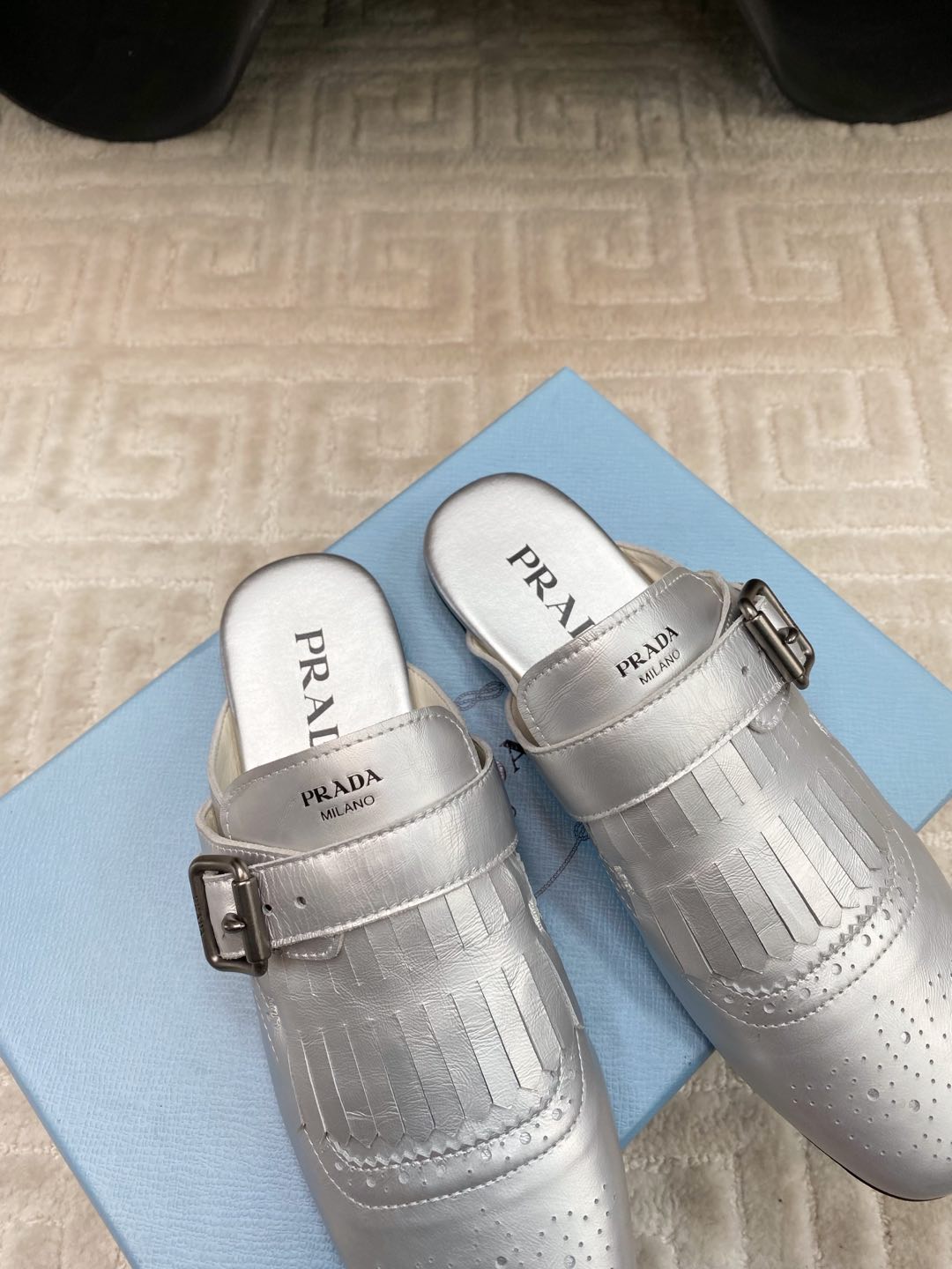 PRADA TASSEL MULES IN SILVER METALLIC LAMBSKIN
