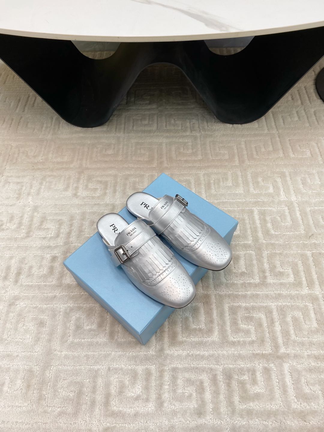 PRADA TASSEL MULES IN SILVER METALLIC LAMBSKIN