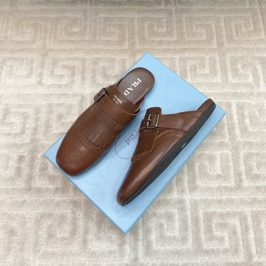 PRADA TASSEL MULES IN RUSSET BROWN LAMBSKIN
