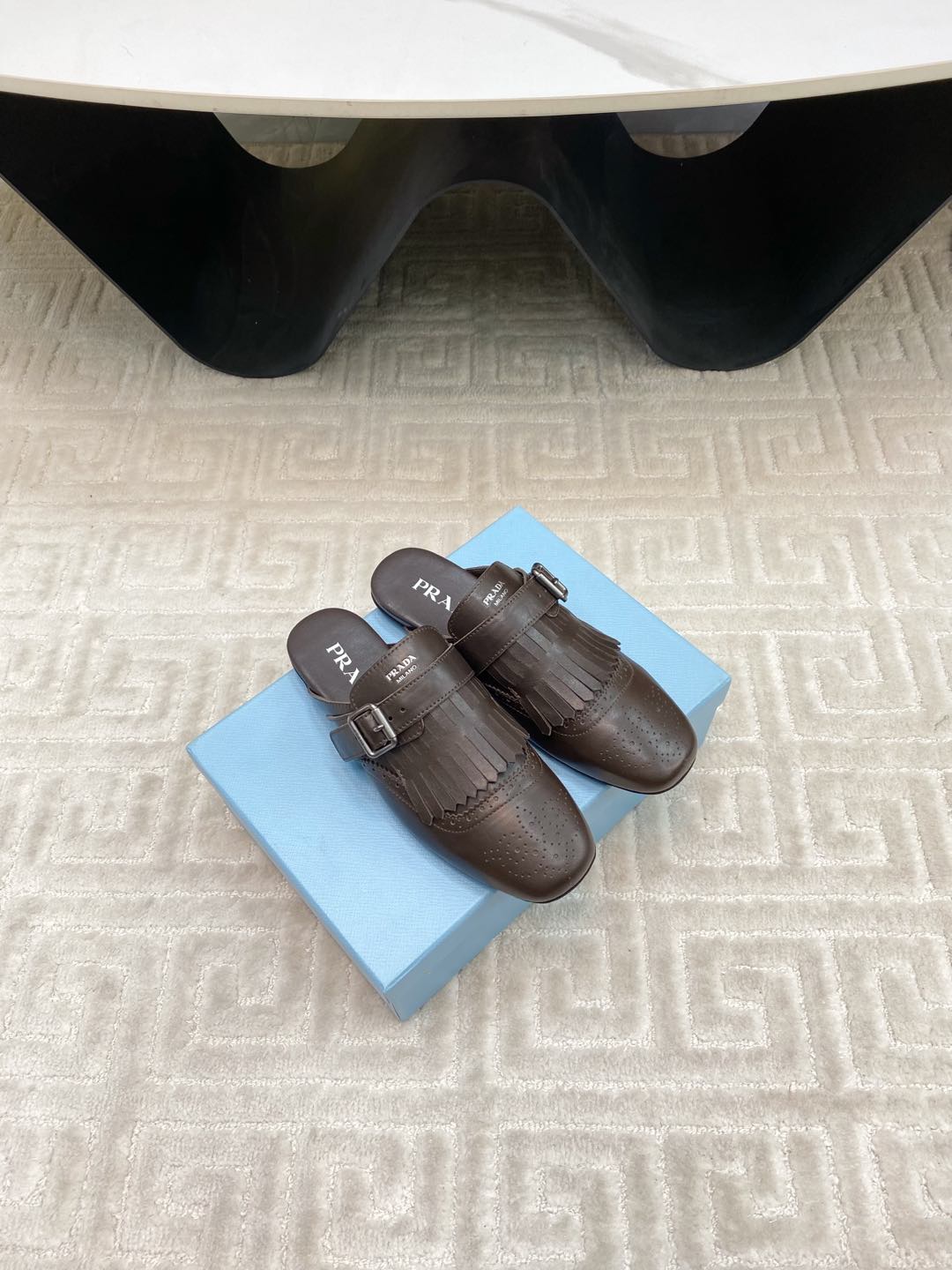 PRADA TASSEL MULES IN WALNUT BROWN LAMBSKIN