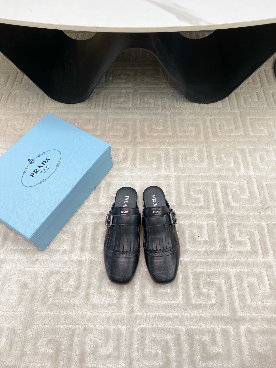 PRADA TASSEL MULES IN BLACK LAMBSKIN