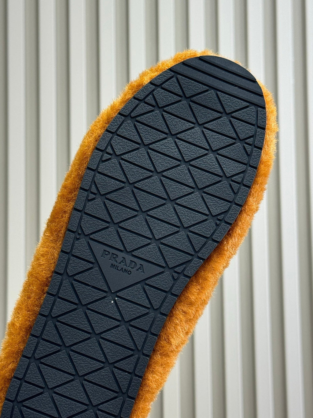 PRADA 25S CLOGS IN RK ORANGE SHEARLING